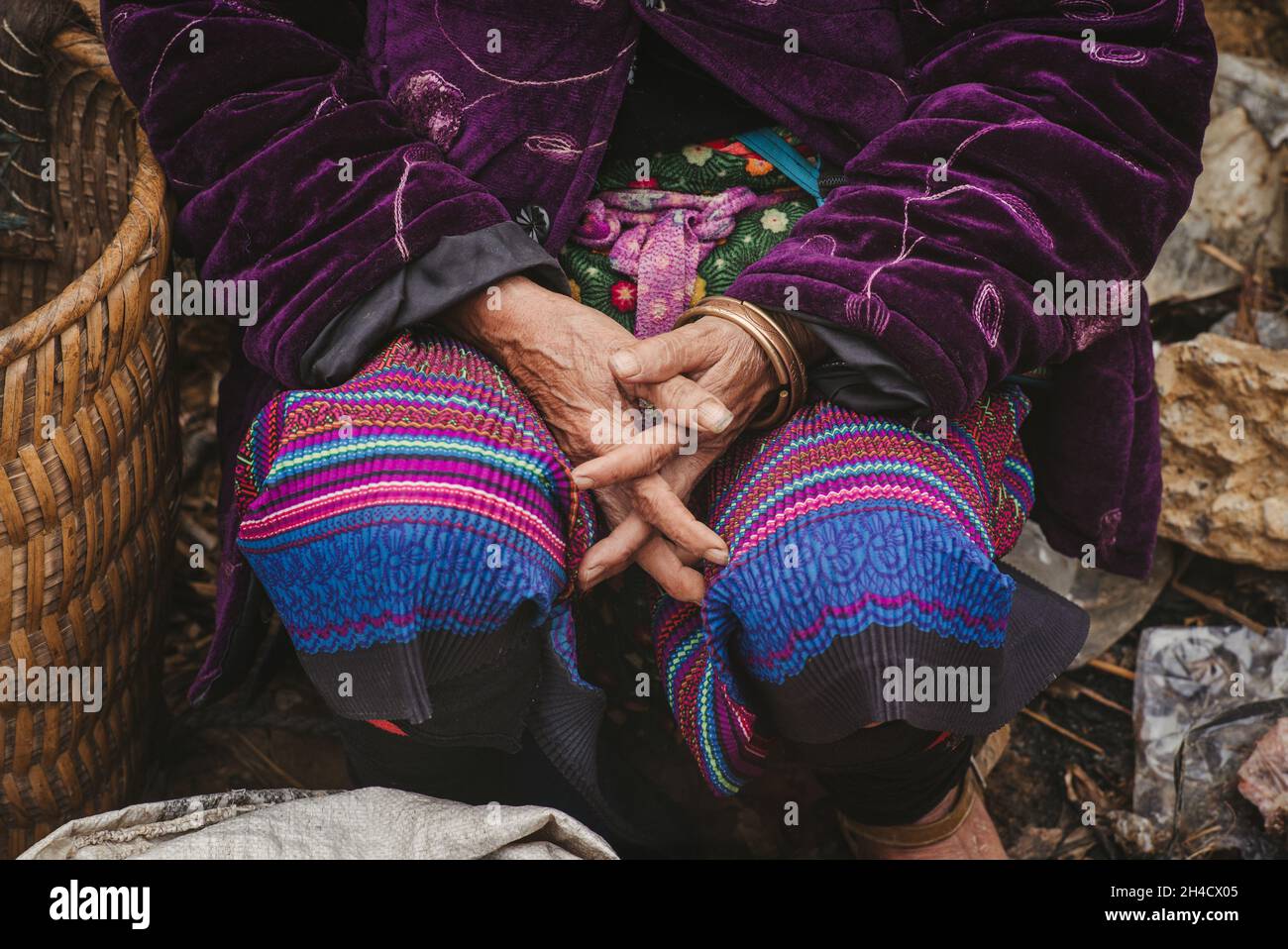 Hands of ethnically diverse senior citizen at the Can Cau market in Vietnam Stock Photo