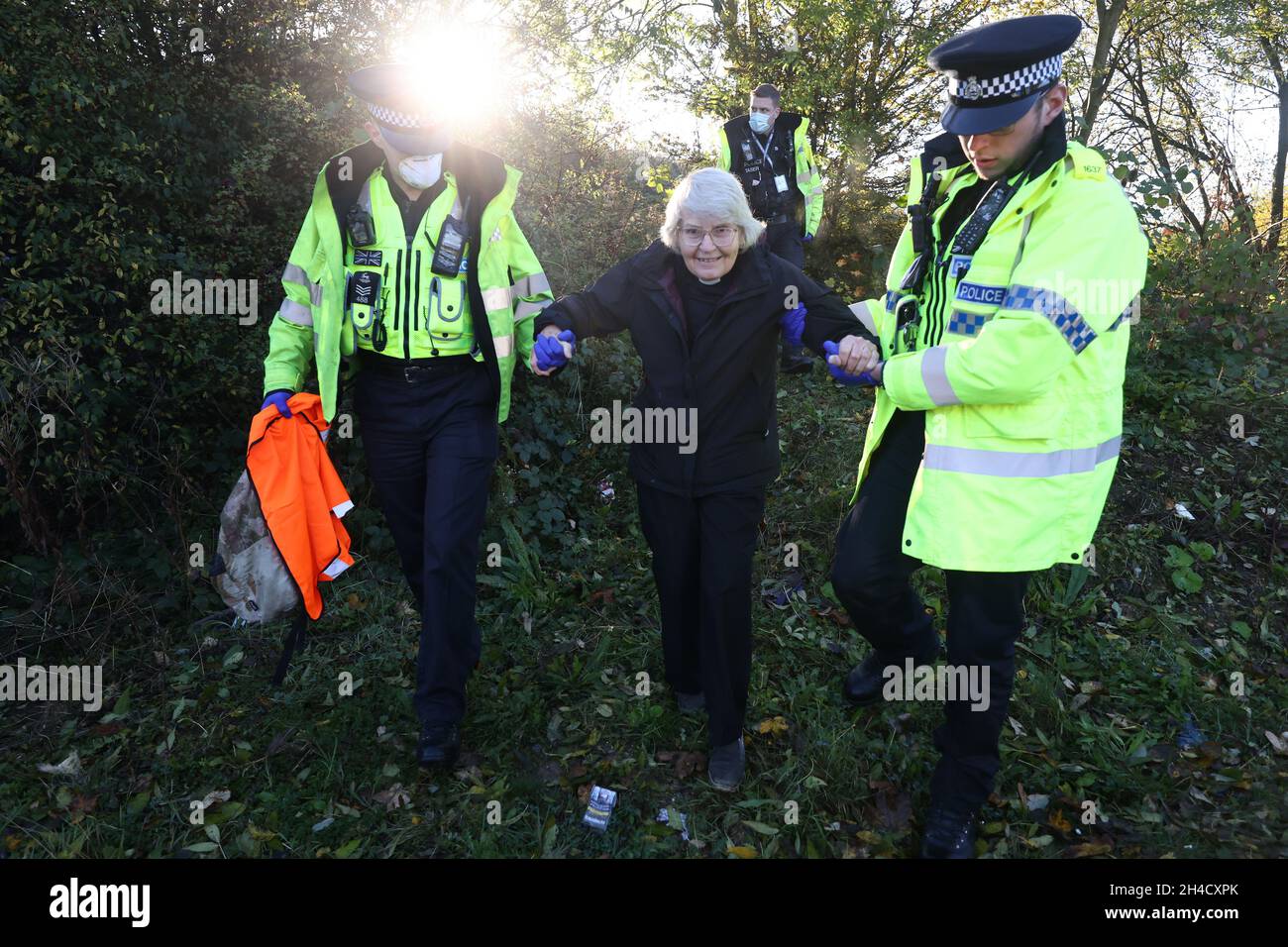 South Mimms, UK. 02nd Nov, 2021. Climate activists from Insulate Britain being arrested after attempting to block traffic on the M25 near junction 23 for the A1. The Climate change protest group have blocked various roads around the capital over a number of weeks, resulting in a court injunction banning them from going near the M25 motorway. Photo credit: Ben Cawthra/Sipa USA **NO UK SALES** Credit: Sipa USA/Alamy Live News Stock Photo