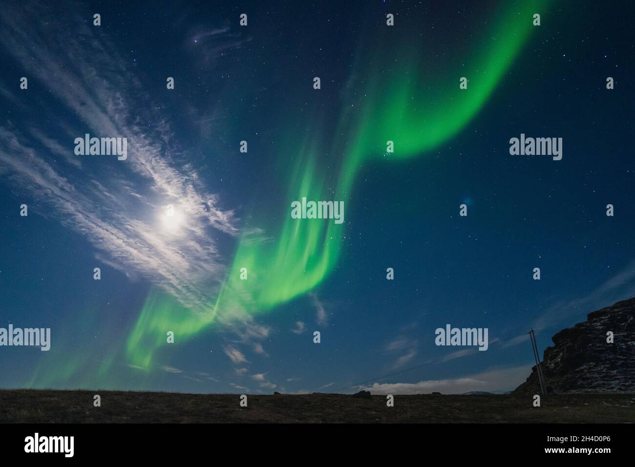 Northern lights known as aurora borealis over the arctic landscape in Norway Stock Photo
