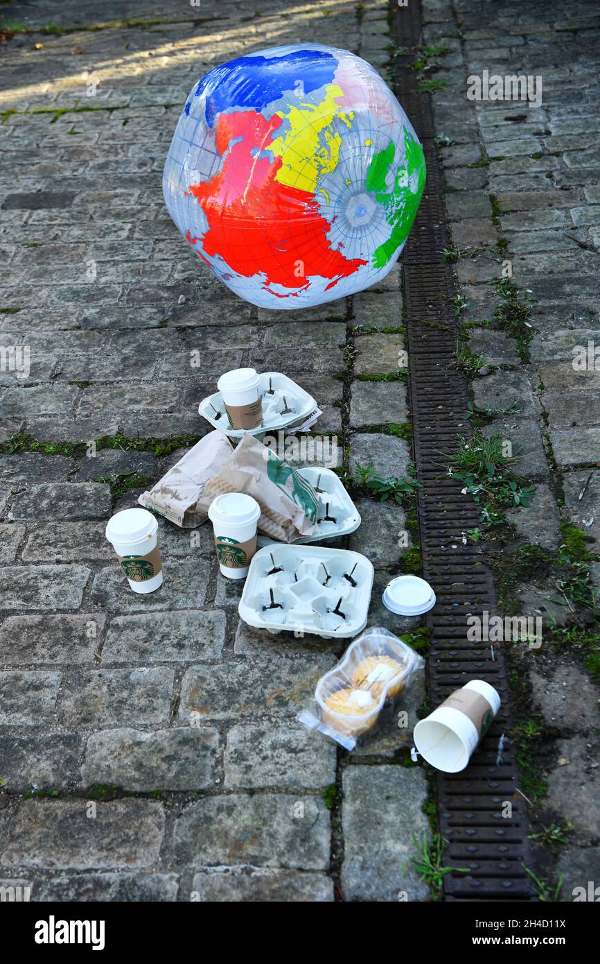 An inflatable globe rests beside detritus left during a media event by climate activists at the UN Climate Change Conference (COP26) in Glasgow, Scotland, Britain November 2, 2021. REUTERS/Dylan Martinez Stock Photo