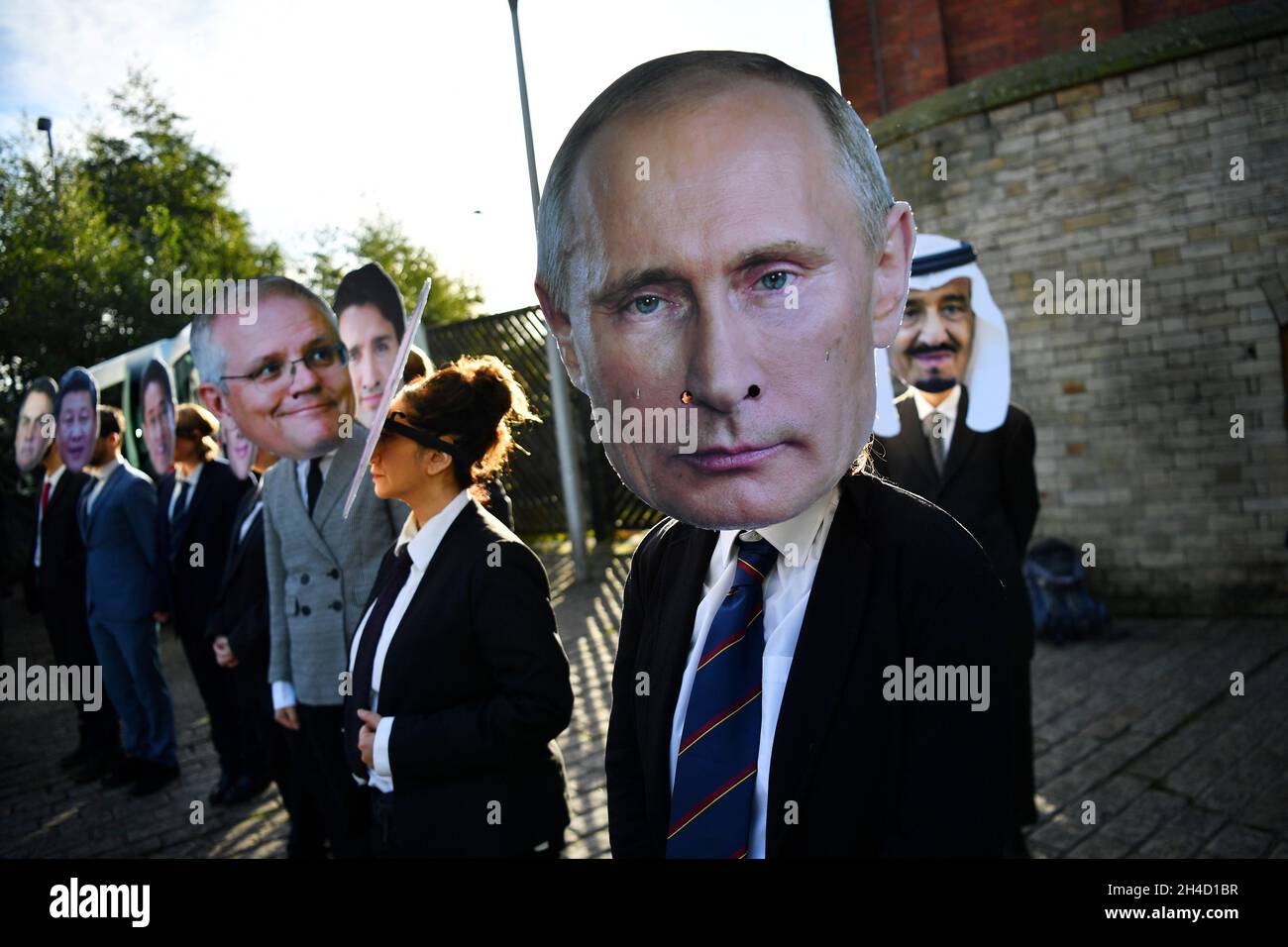 Climate activists dressed as world leaders prepare to take part in a media event during the UN Climate Change Conference (COP26) in Glasgow, Scotland, Britain November 2, 2021. REUTERS/Dylan Martinez Stock Photo