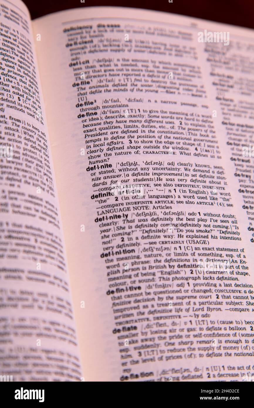 Longman Dictionary open page showing the definition of the word DEFINITE and other words Stock Photo
