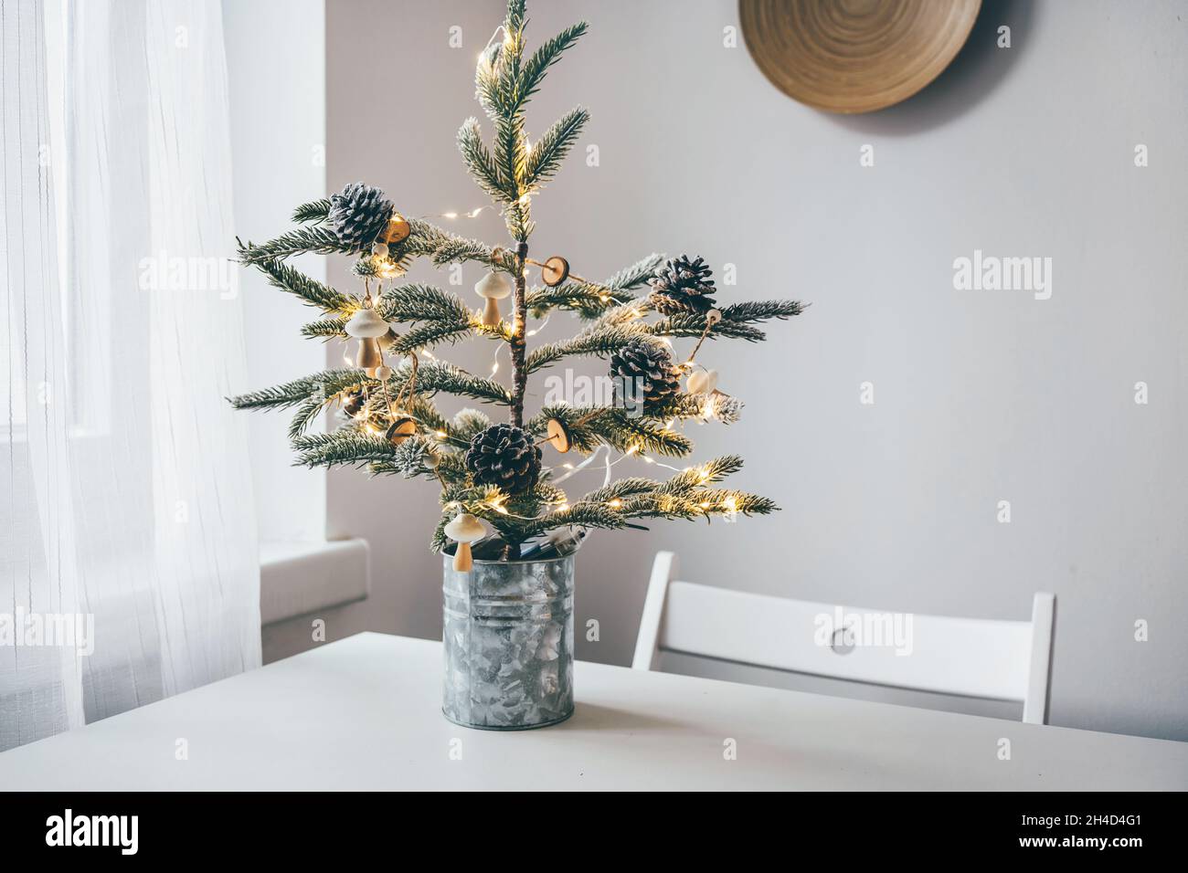 Reusable minimalistic Christmas tree in white interior Stock Photo Alamy