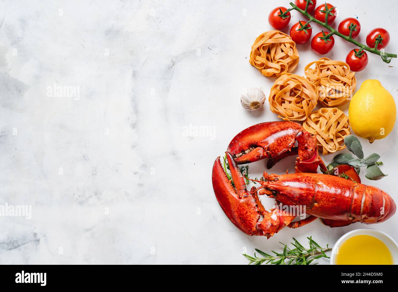 Delicious freshly cooked lobster with black pasta and vegetables Stock Photo