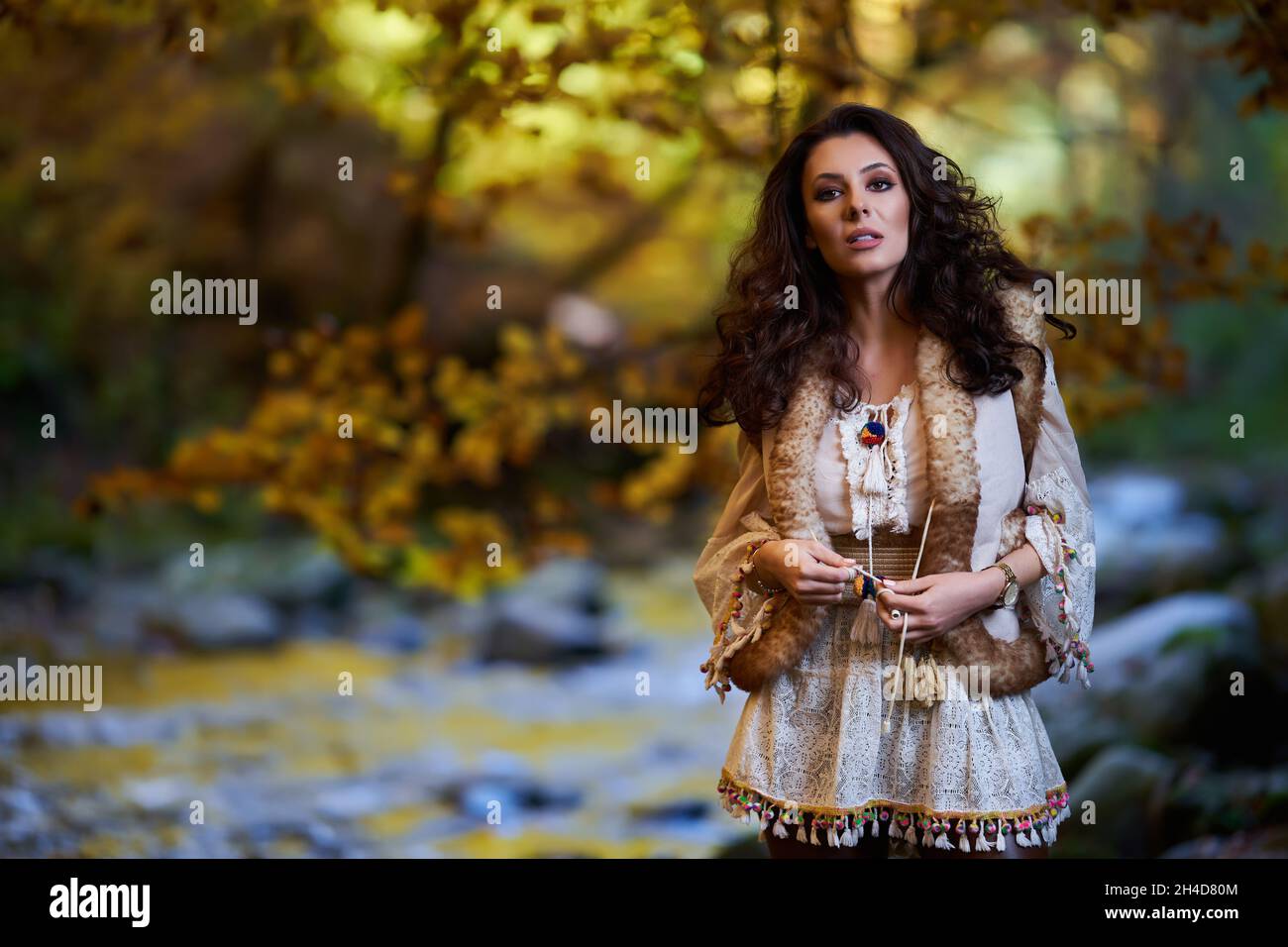 Portrait of a beautiful young woman by the river mid autumn Stock Photo ...