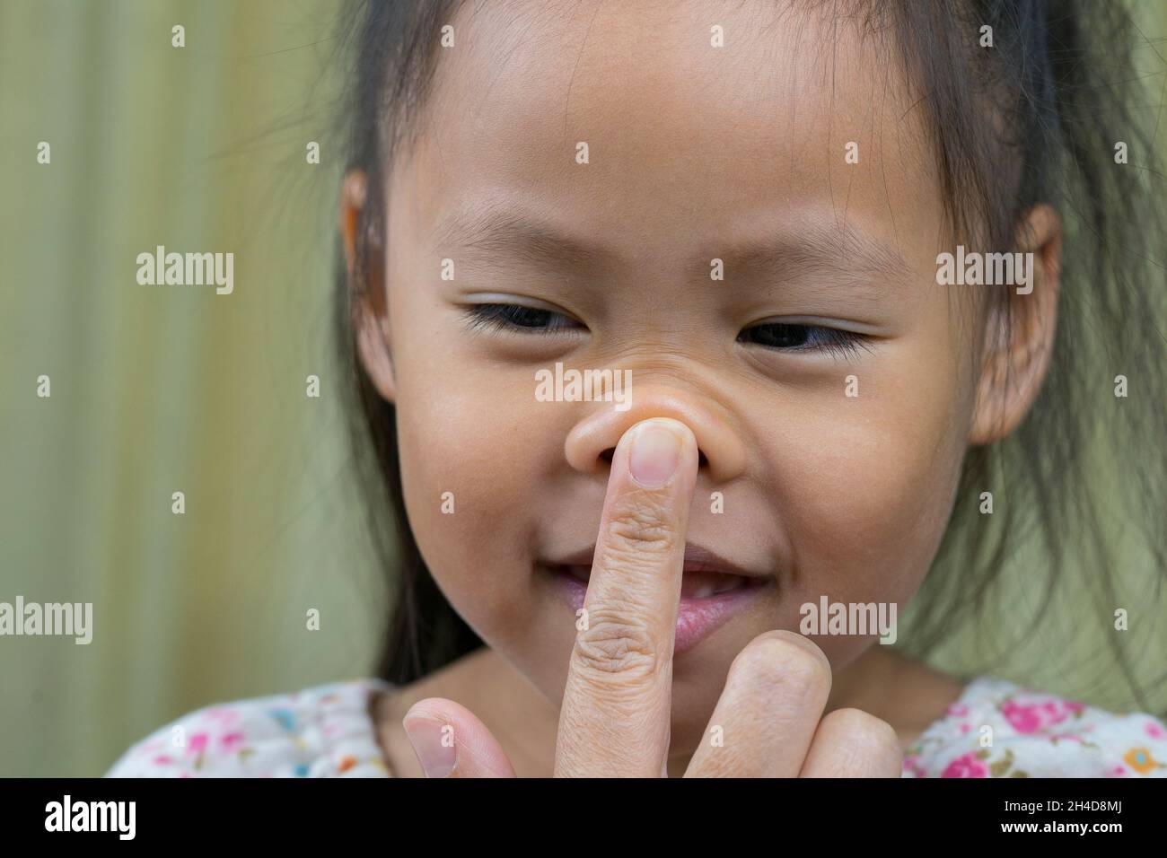 Woman Pinching Cheeks Hi Res Stock Photography And Images Alamy
