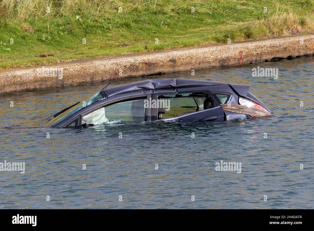 Souithport, Merseyside. UK Weather 02 Nov 2021. Bad weather overnight as  Ford Fiesta with three female passengers crashed through metal barrier and  fell into Marine lake. Three passengers were unhurt having made