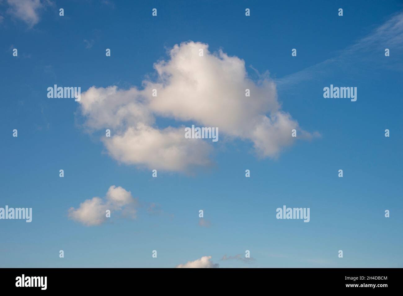 Single white cloud in a blue sky Stock Photo