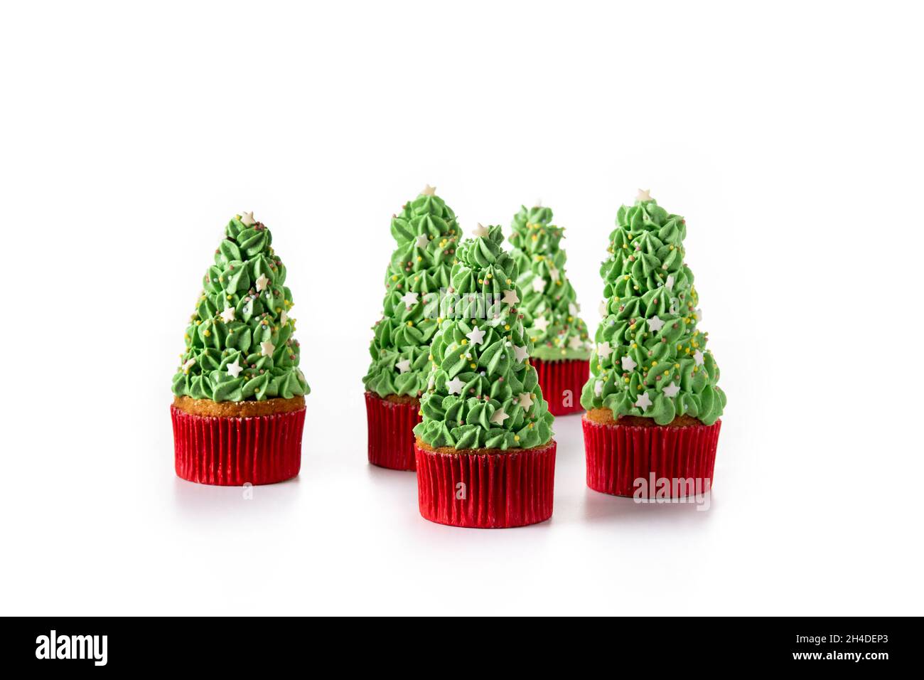 Christmas tree cupcakes isolated on white background Stock Photo