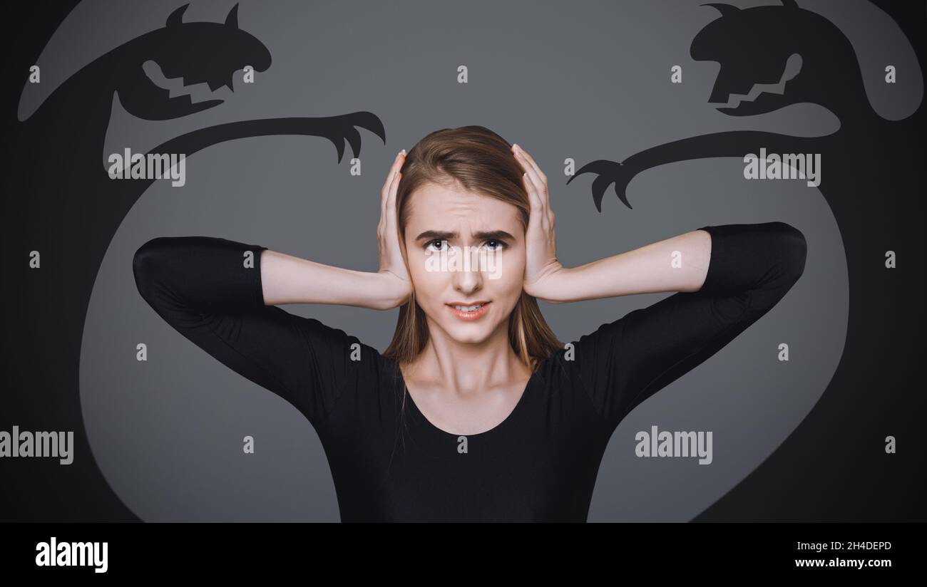 Scared Young Woman Covering Ears, Afraid Of Shadow Monsters Drawn
