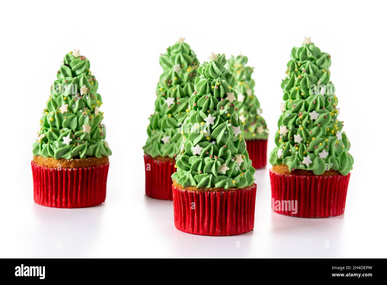 Christmas tree cupcakes isolated on white background Stock Photo