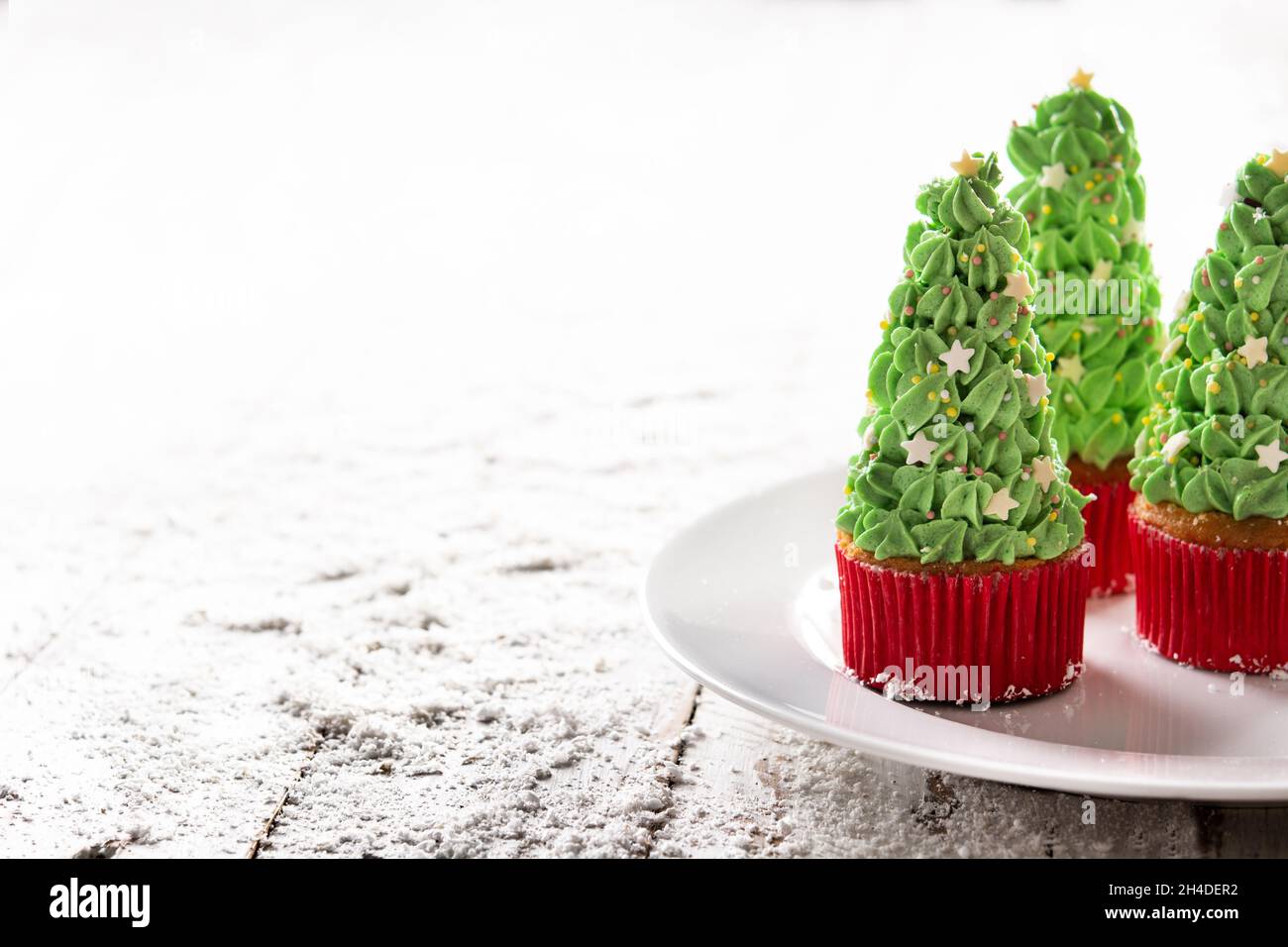 Christmas tree cupcakes on snow Stock Photo