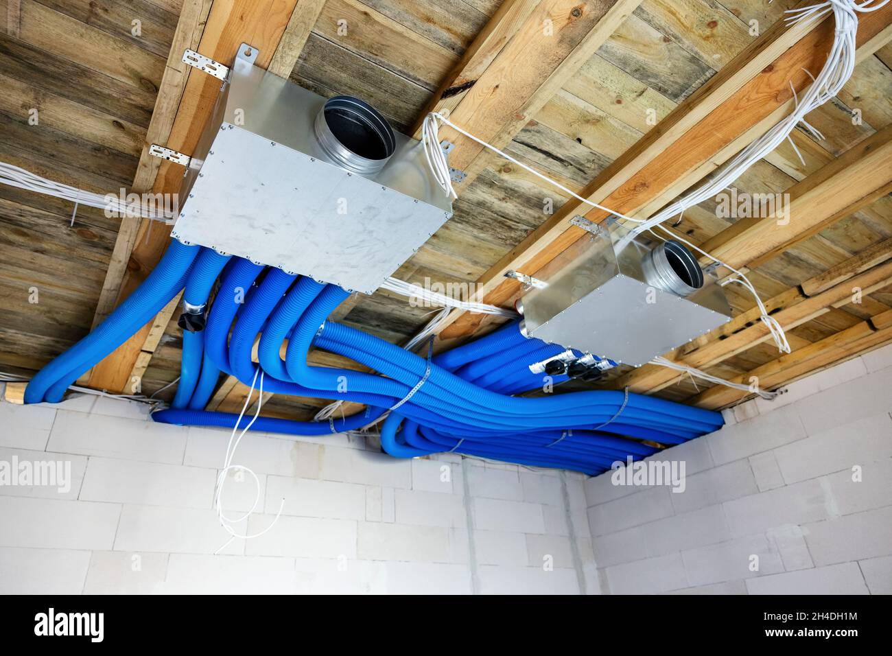 heat recovery ventilation system installation in new house. air filtration Stock Photo
