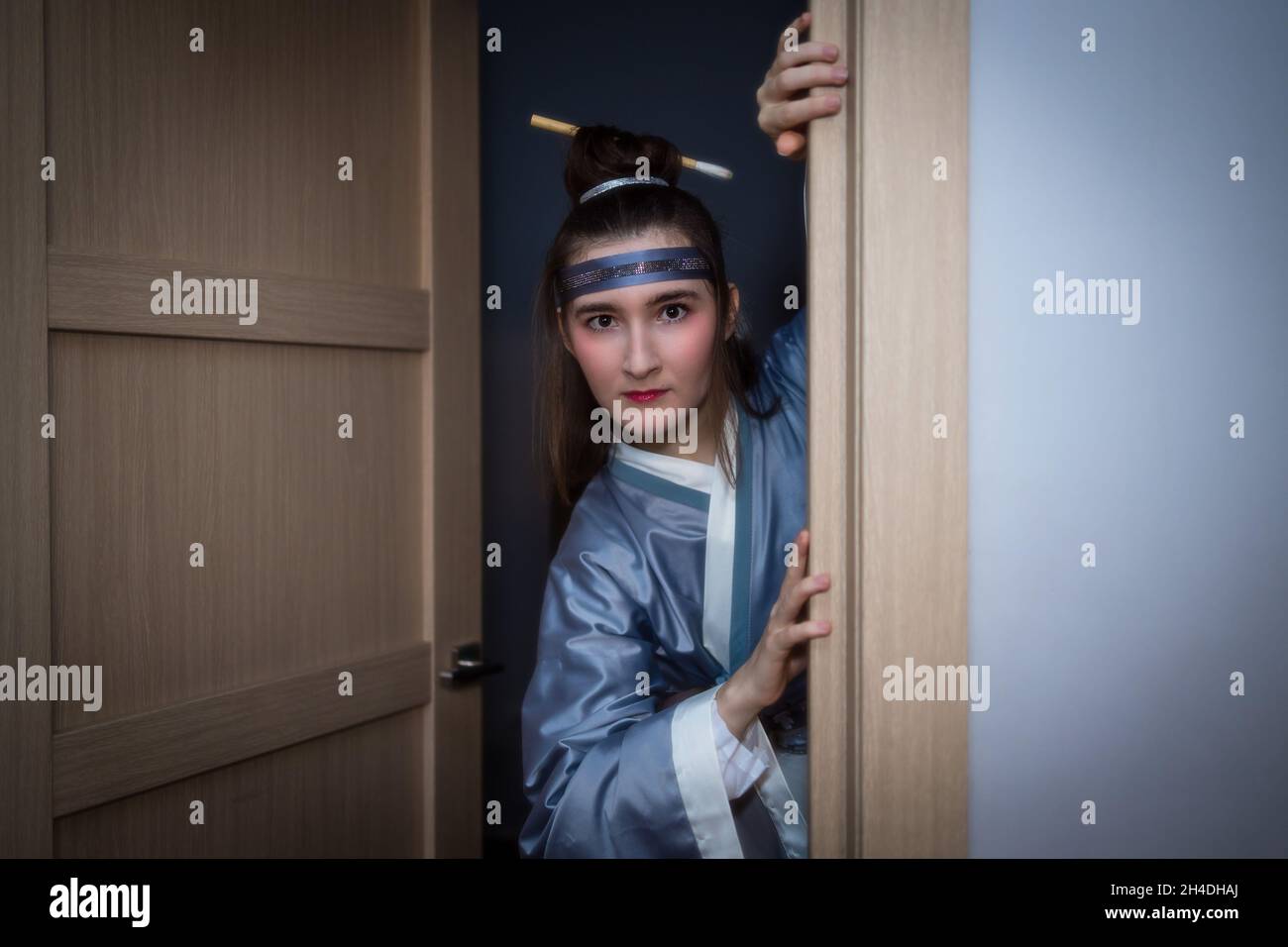 Caucasian woman posing in traditional Chinese hanfu dress. Concept