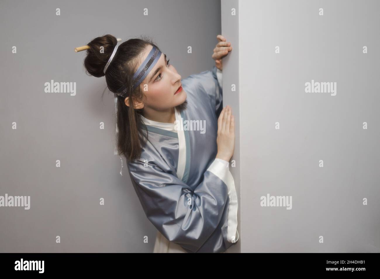 Caucasian woman posing in traditional Chinese hanfu dress. Concept