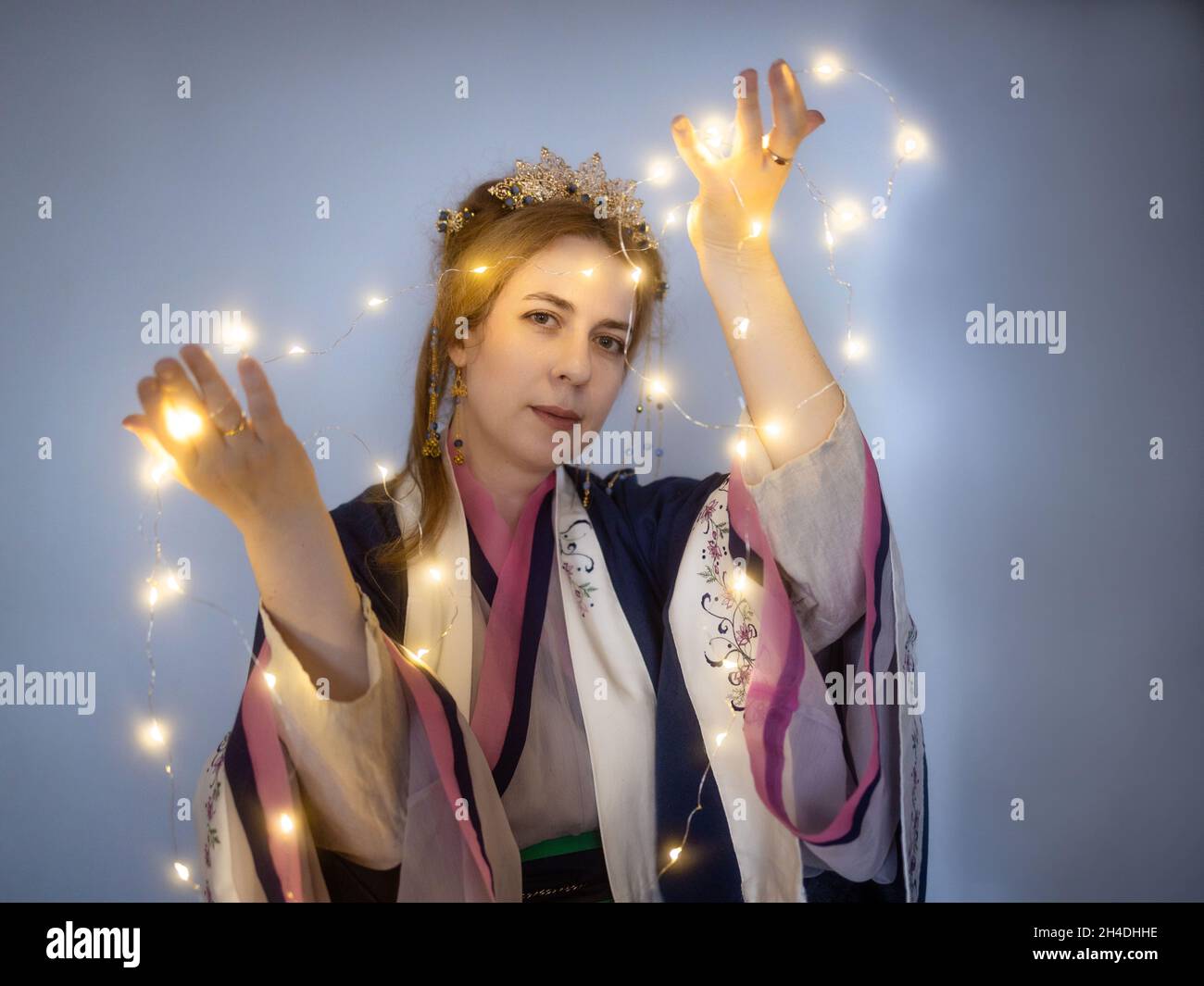 Caucasian blond woman in traditional Chinese hanfu dress. Concept interest in China