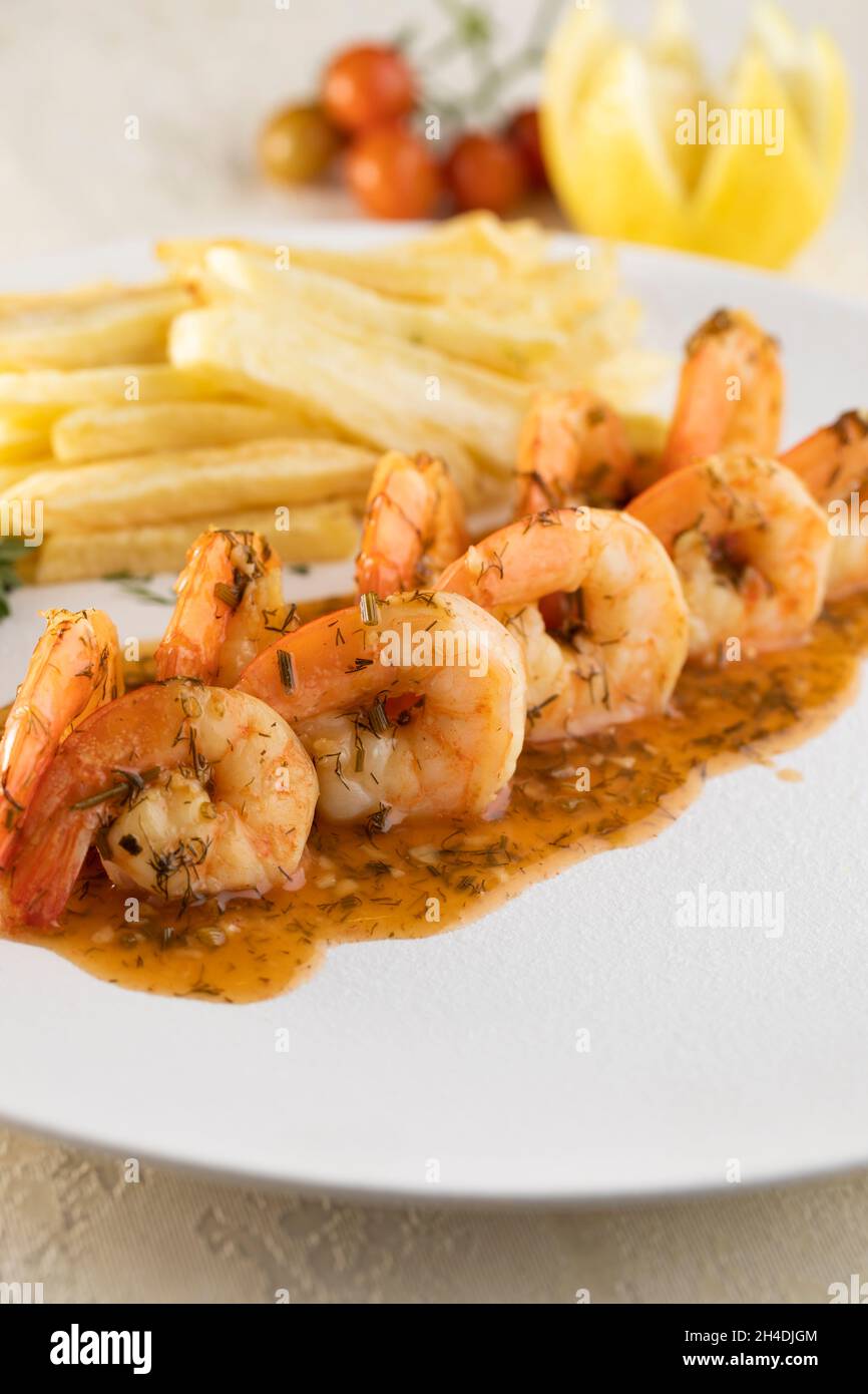 Fried, grilled and crispy shrimp with potato fingers Stock Photo