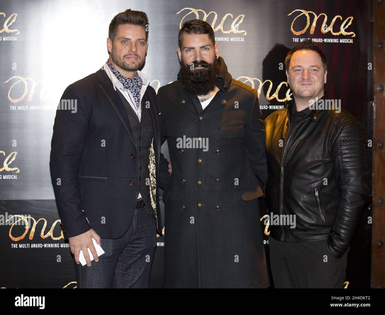 Boyzone members Keith Duffy, left, Mikey Graham and Shane Lynch attend the opening night of Ronan Keating joining the cast of Once the musical Stock Photo