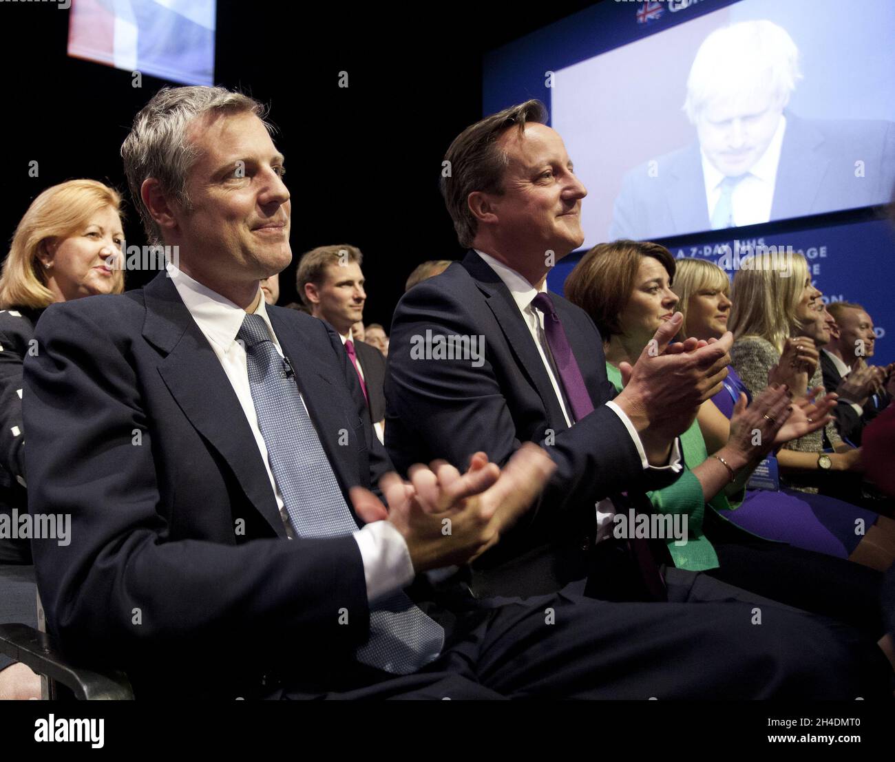 London mayoral candidate Zac Goldsmith and Prime Minister David Cameron listen to Mayor of London Boris Johnson delivering his speech to delegates in the third day of the Conservative Party annual conference at Manchester Central Convention Centre. Stock Photo