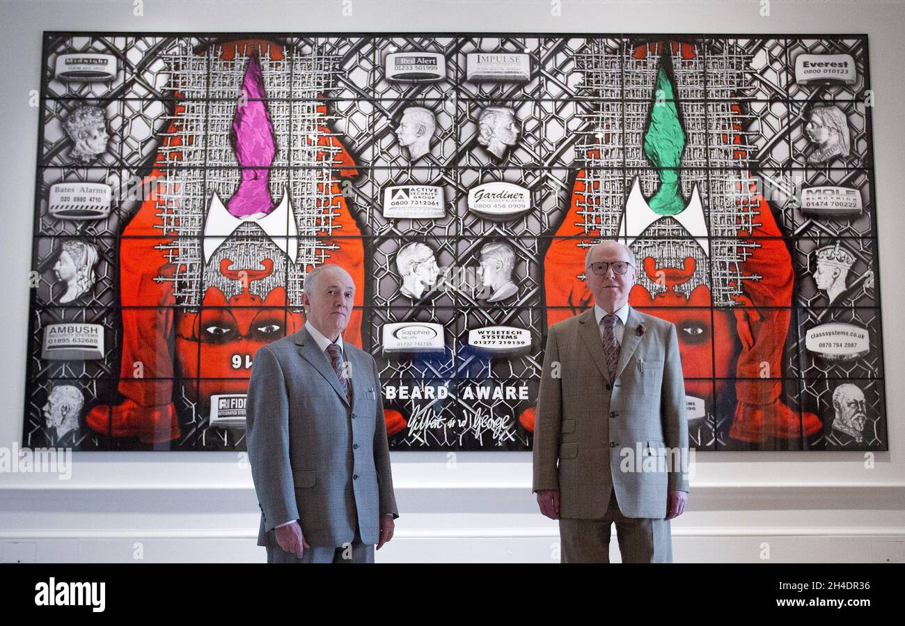 Artists Gilbert & George pose in front of their major new picture, BEARD AWARE (2016) at the Royal Academy of Arts on Tuesday 7 June.  Stock Photo