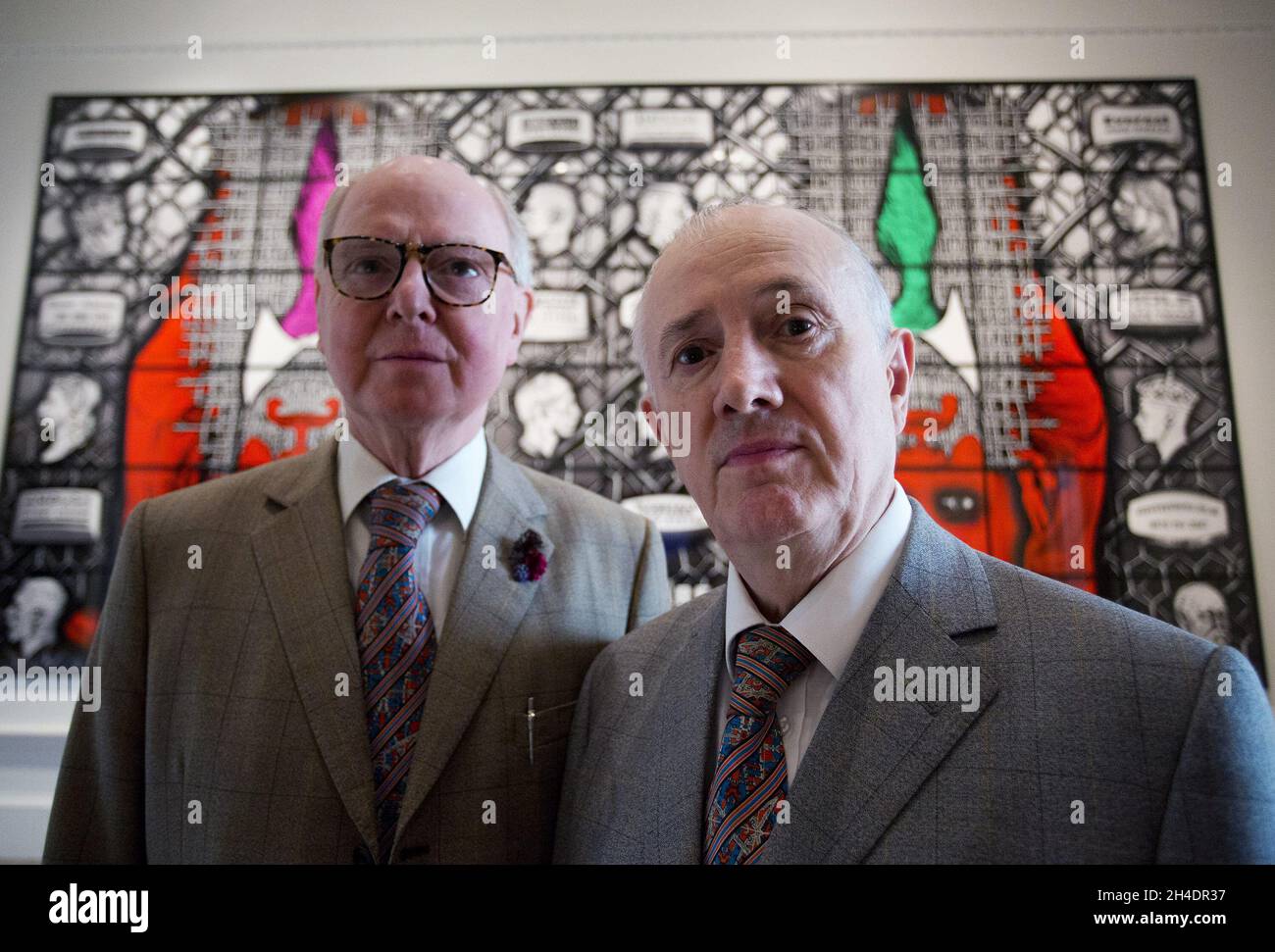 Artists Gilbert & George pose in front of their major new picture, BEARD AWARE (2016) at the Royal Academy of Arts on Tuesday 7 June.  Stock Photo