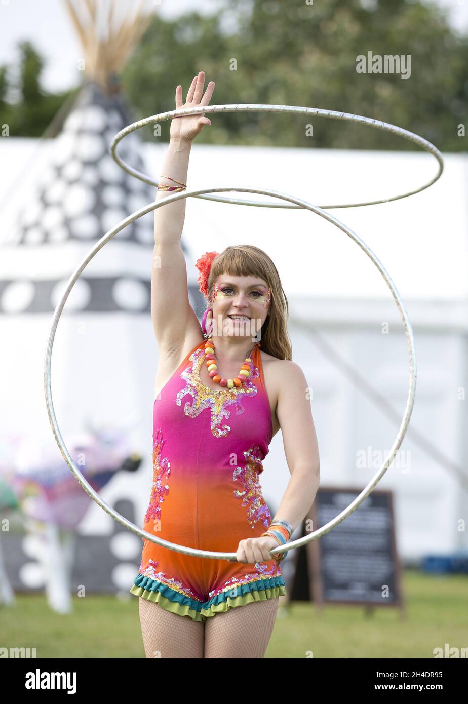 A hulahoop artist dance at the main stage in the Isle of Wight