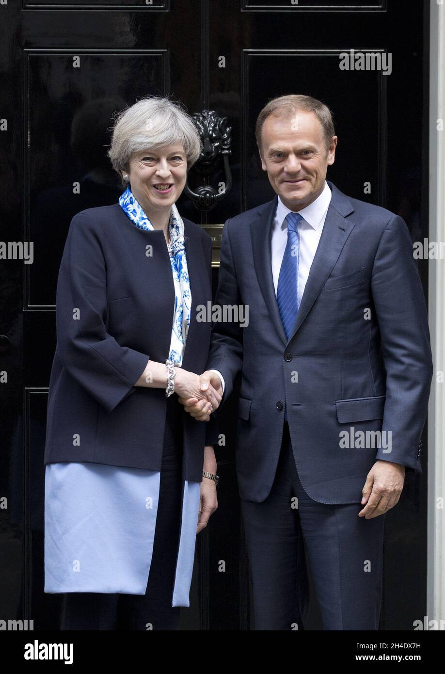 British Prime Minister Theresa May steps out Downing Street, London, to greet European Council President Donald Tusk Stock Photo