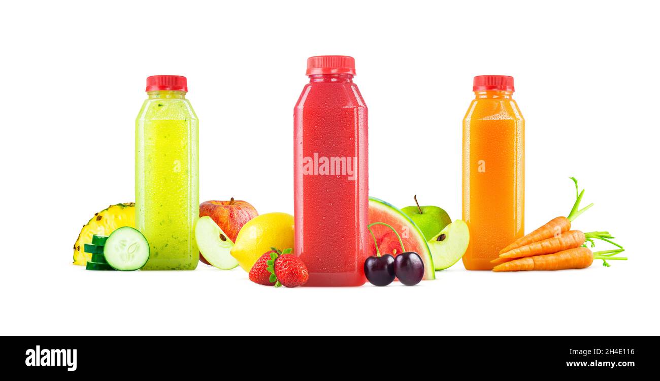Three Flavors of Freshly Squeezed Fruit and Vegetable Juices in Generic Plastic Bottles with Garnishes Isolated on White Background Stock Photo
