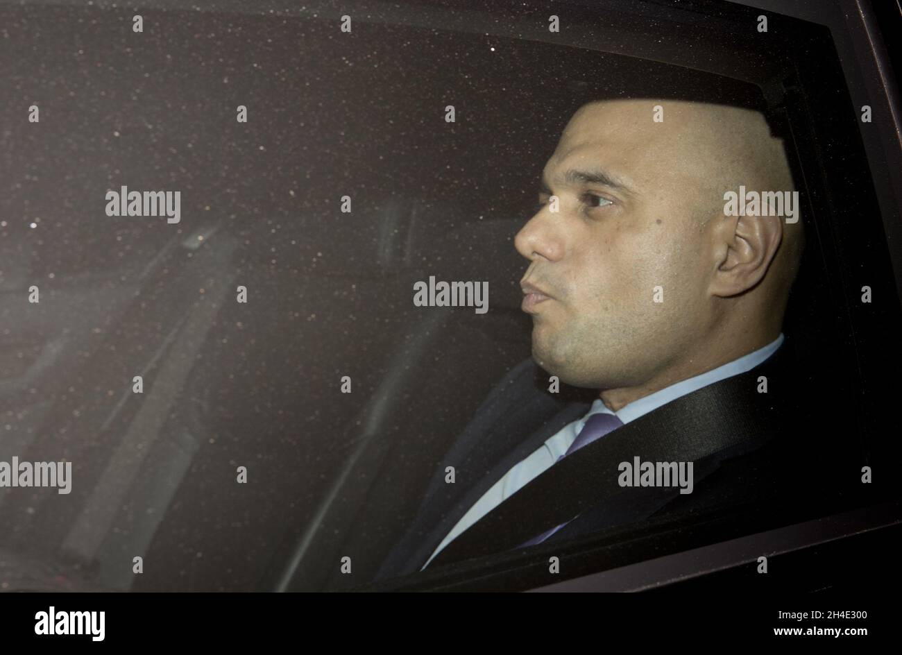 Home Secretary Sajid Javid is driven out the Houses of Parliament , London, following the no confidence vote to Prime Minister Theresa May. Picture dated: Wednesday December 12, 2018 Stock Photo