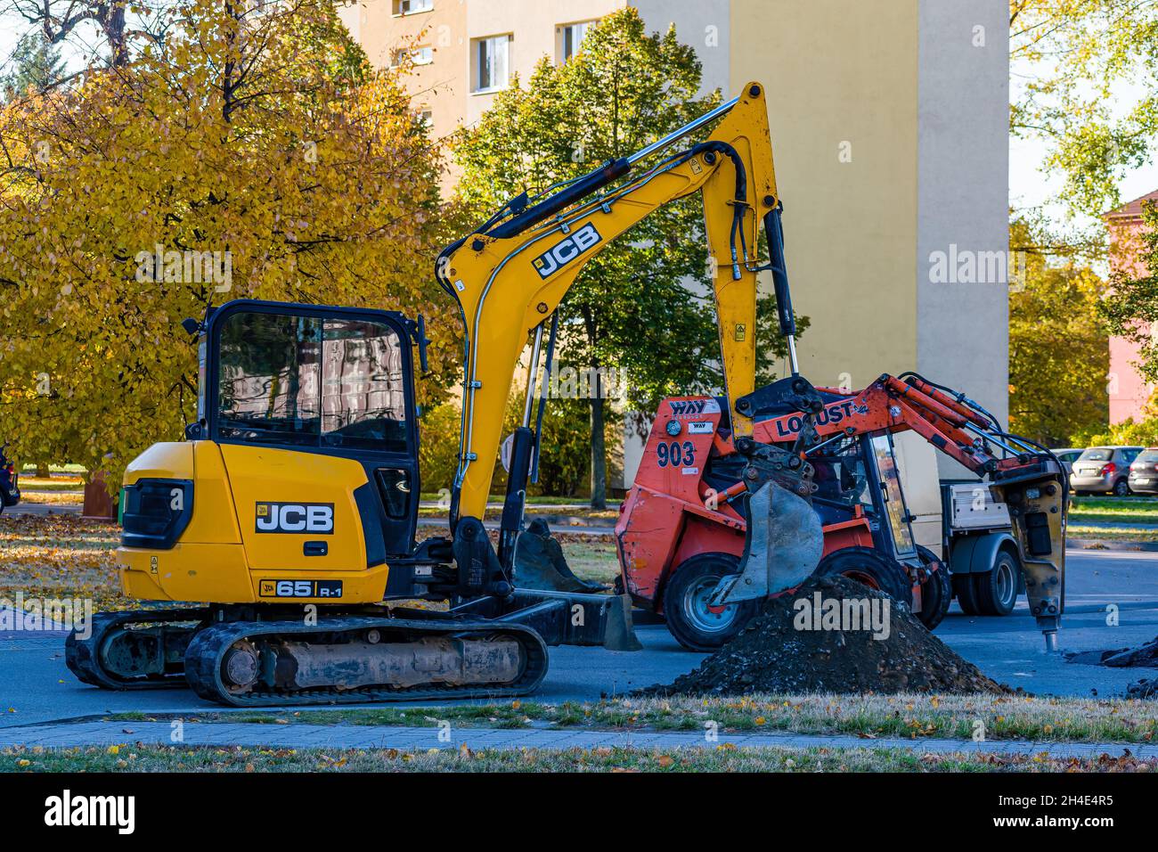 HODONIN, CZECH REPUBLIC - Oct 26, 2021: Belt excavator JCB 65 and shear loader Locust 903 at work on the road Stock Photo
