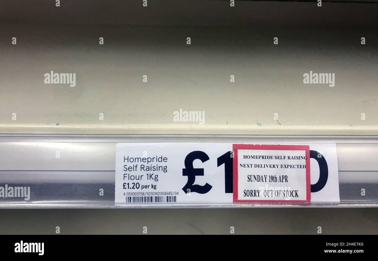 An Empty Shelf Is Out Of Stock On Packets Of Flour In A Tesco Store In