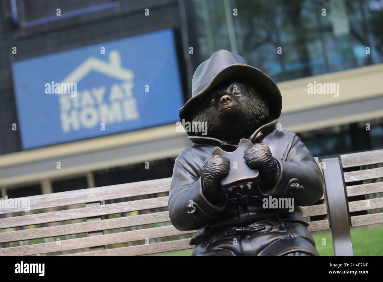 A Paddington Bear statue in an empty bench in Leicester Square, London