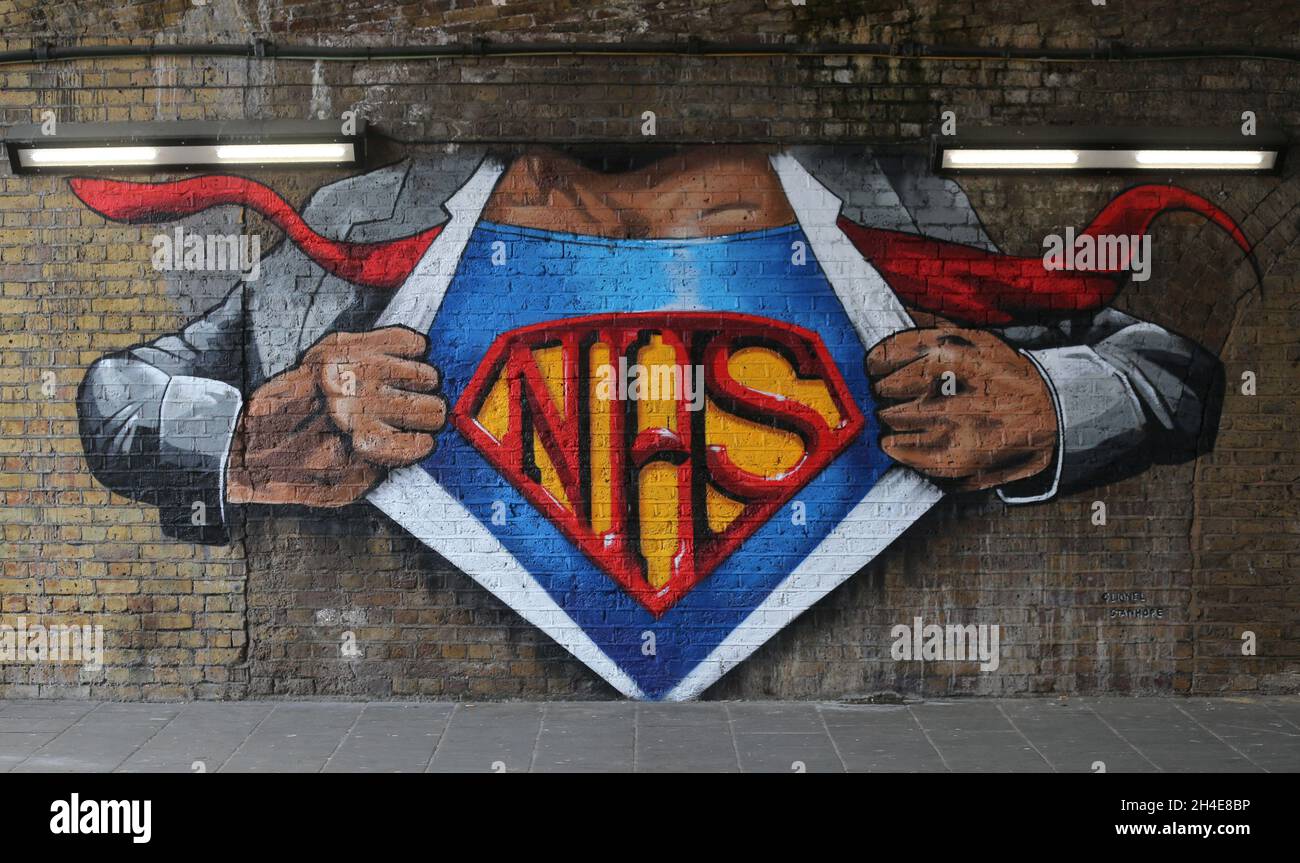 A NHS superman graffiti by street artist Lionel Stanhope to pay tribute to NHS workers by Waterloo, London, as the UK continues in lockdown to help curb the spread of the coronavirus. Picture date: Friday May 8, 2020. Stock Photo