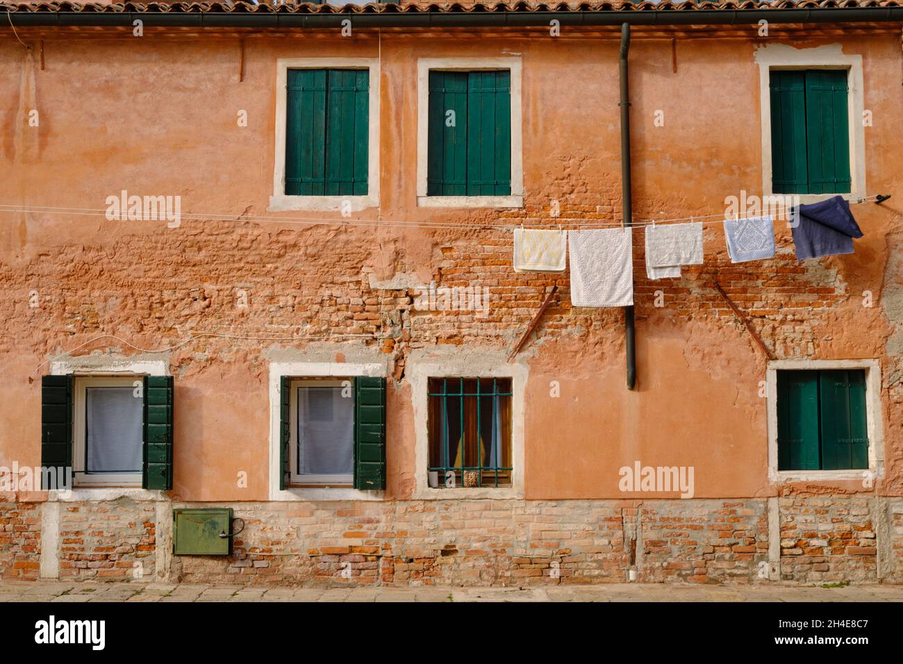 Washing hanging outside house on clothes line in Venice Italy Stock Photo
