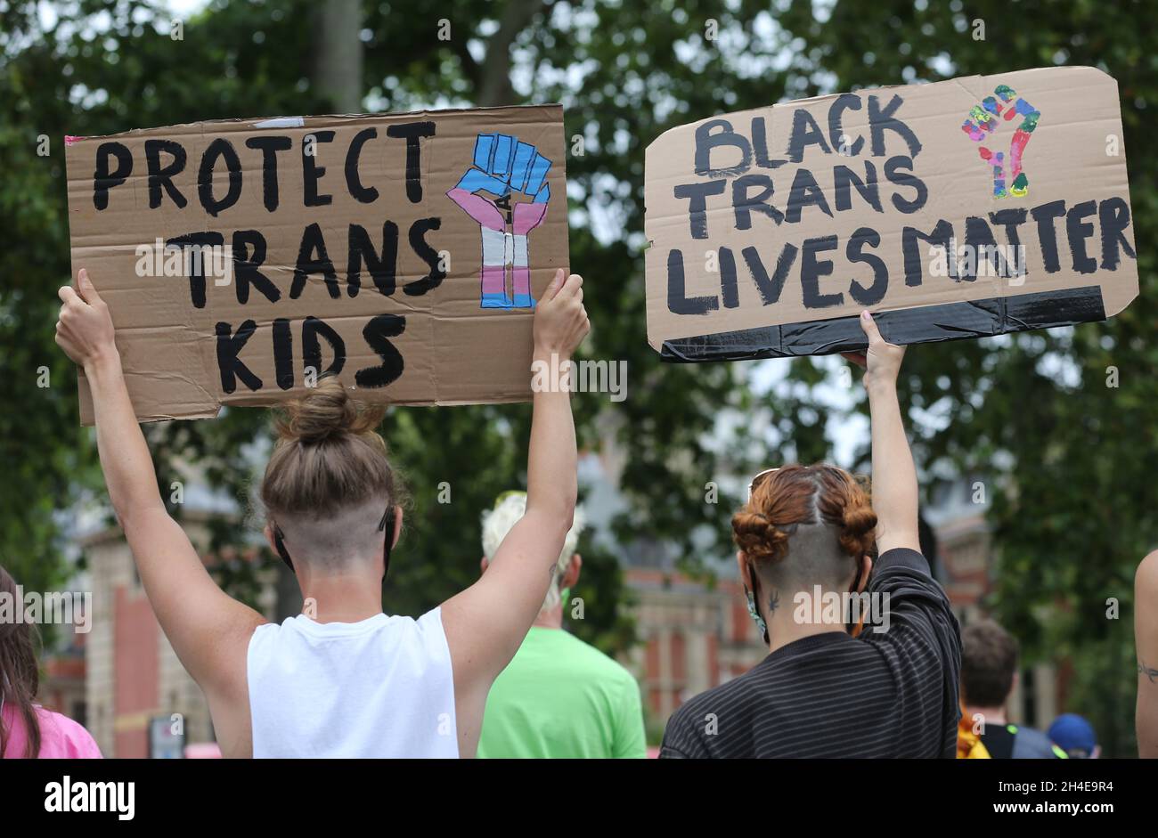 Demonstrators holding placards calling to protect transgender kids rights during a Black Trans Lives Matter protest at Parliament Square, London, following a raft of Black Lives Matter protests across the UK. Picture date: Saturday July 4, 2020. Stock Photo