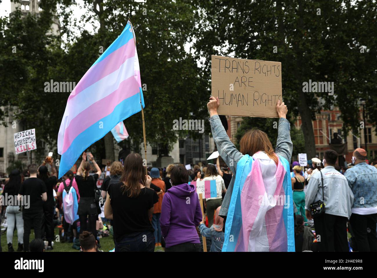 Demonstrators holding placards calling for transgender rights during a Black Trans Lives Matter protest at Parliament Square, London, following a raft of Black Lives Matter protests across the UK. Picture date: Saturday July 4, 2020. Stock Photo