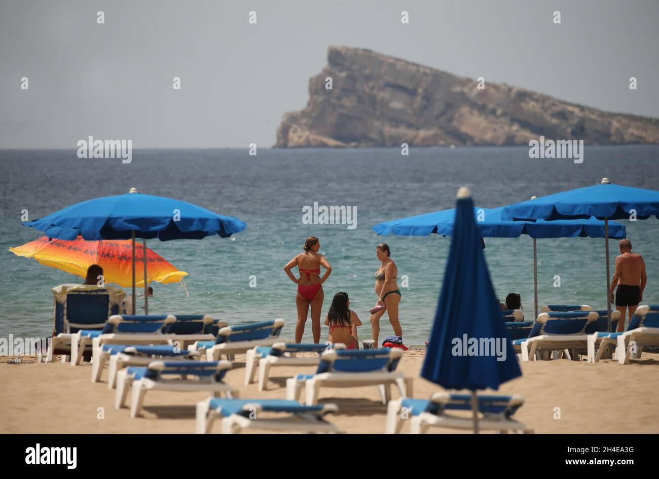 Sunbathers on the Levante beach in Benidorm, a seaside resort on the eastern coast of Spain, which remains almost empty following the UK government’s quarantine to all tourists that travel from Spain because of its high levels of COVID-19 cases. Picture date: Thursday July 30, 2020. Stock Photo