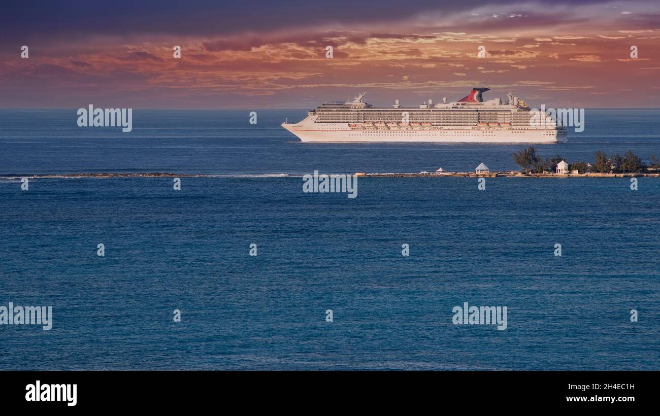 Nassau, Bahamas - March 1, 2018:  Carnival Cruise Lines cruise ship departs from the Port of Bahamas during evening hours Stock Photo