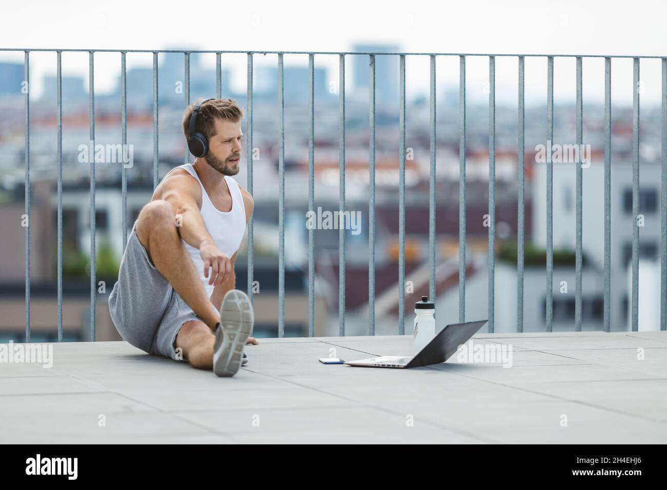 Handsome young man training and working out outdoors Stock Photo