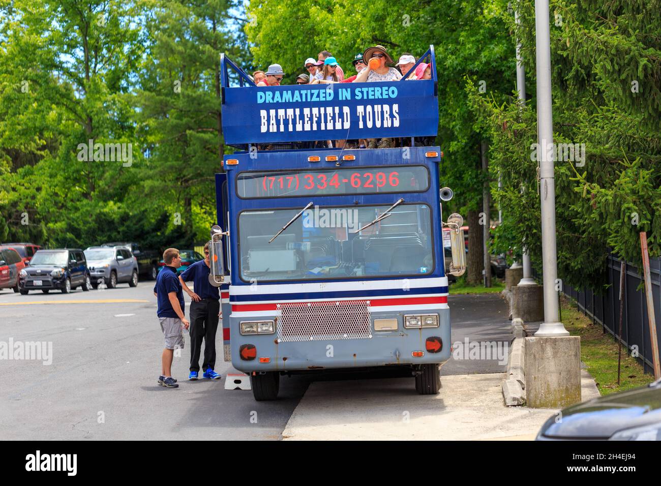 Gettysburg, PA, USA - July 2, 2016: Tourists prepare to tour the battlefield on a bus in downtown Gettysburg during the annual Battle commemoration. Stock Photo