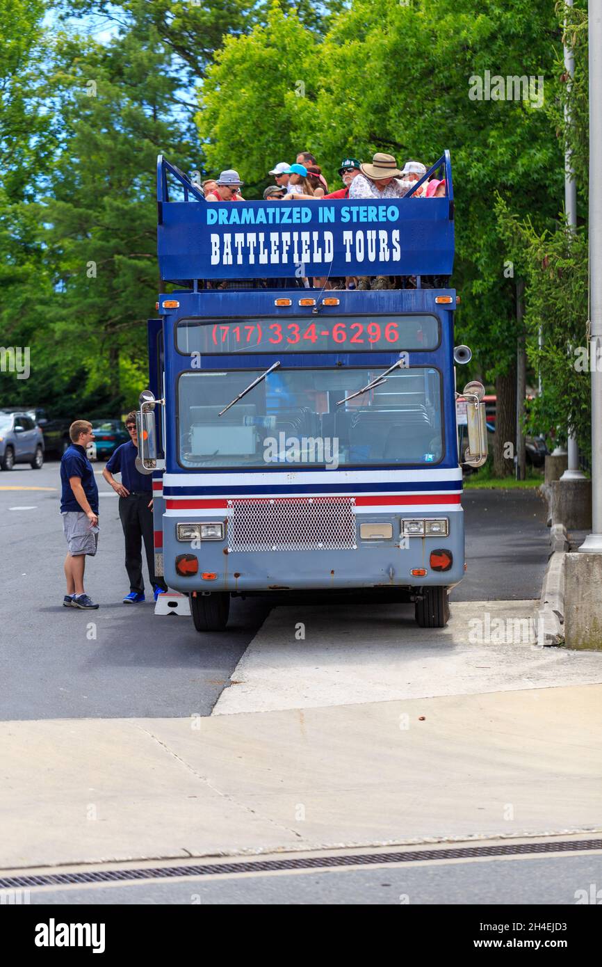 Gettysburg, PA, USA - July 2, 2016: Tourists prepare to tour the battlefield on a bus in downtown Gettysburg during the annual Battle commemoration. Stock Photo