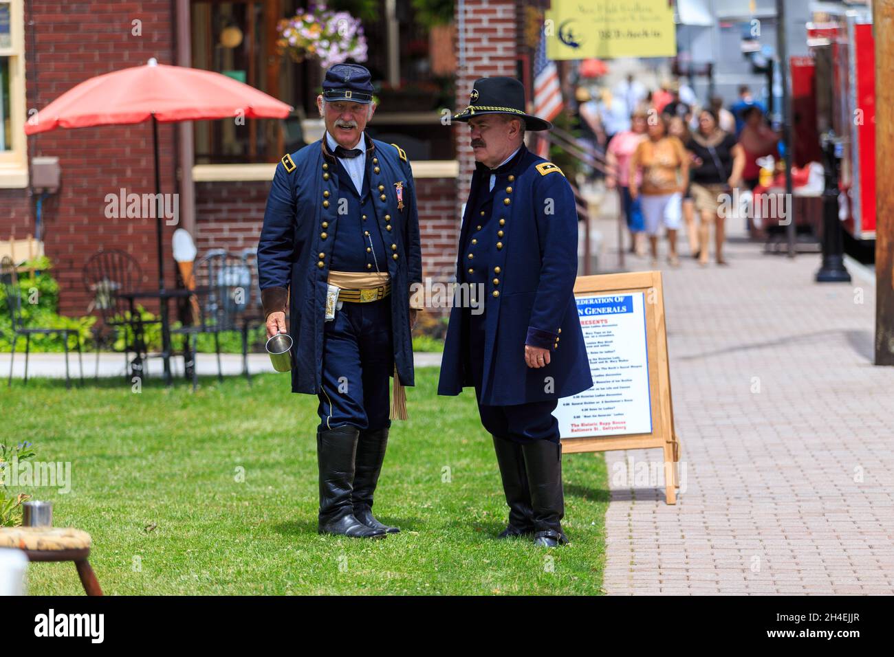 Gettysburg, PA, USA - July 2, 2016: A woman wearing a typical civil war period dress appears in downtown Gettysburg during the annual Battle commemora Stock Photo
