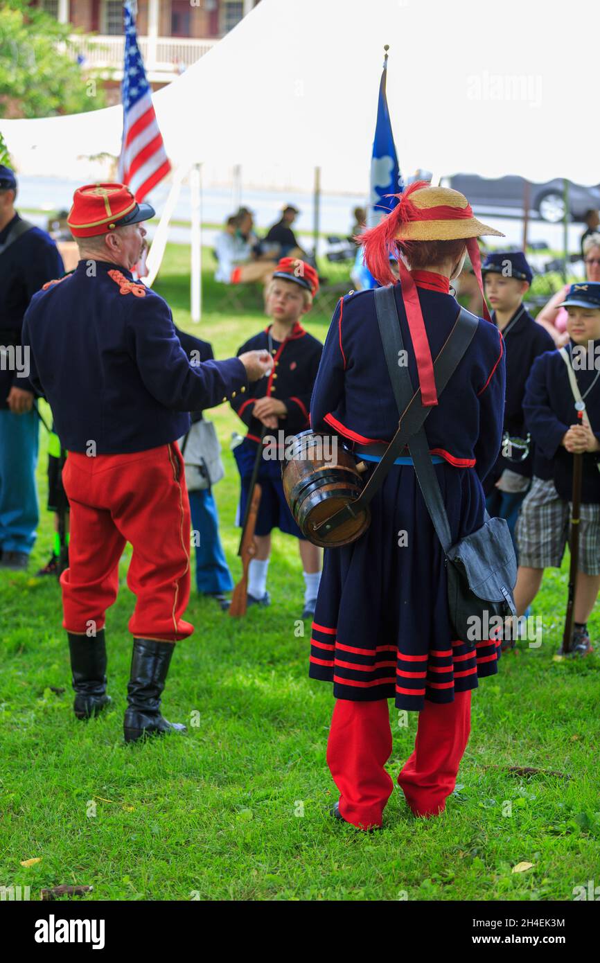 Gettysburg, PA, USA - July 2, 2016: Young boys received instruction from reenactors wearing typical civil war period clothing in the downtown Gettysbu Stock Photo