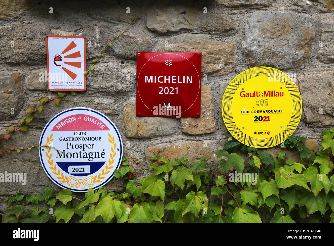 CARCASSONNE, FRANCE - OCTOBER 4, 2021: Signs on a local restaurant in Carcassonne with prestigious awards: Michelin Star and Gault and Millau prize. Stock Photo