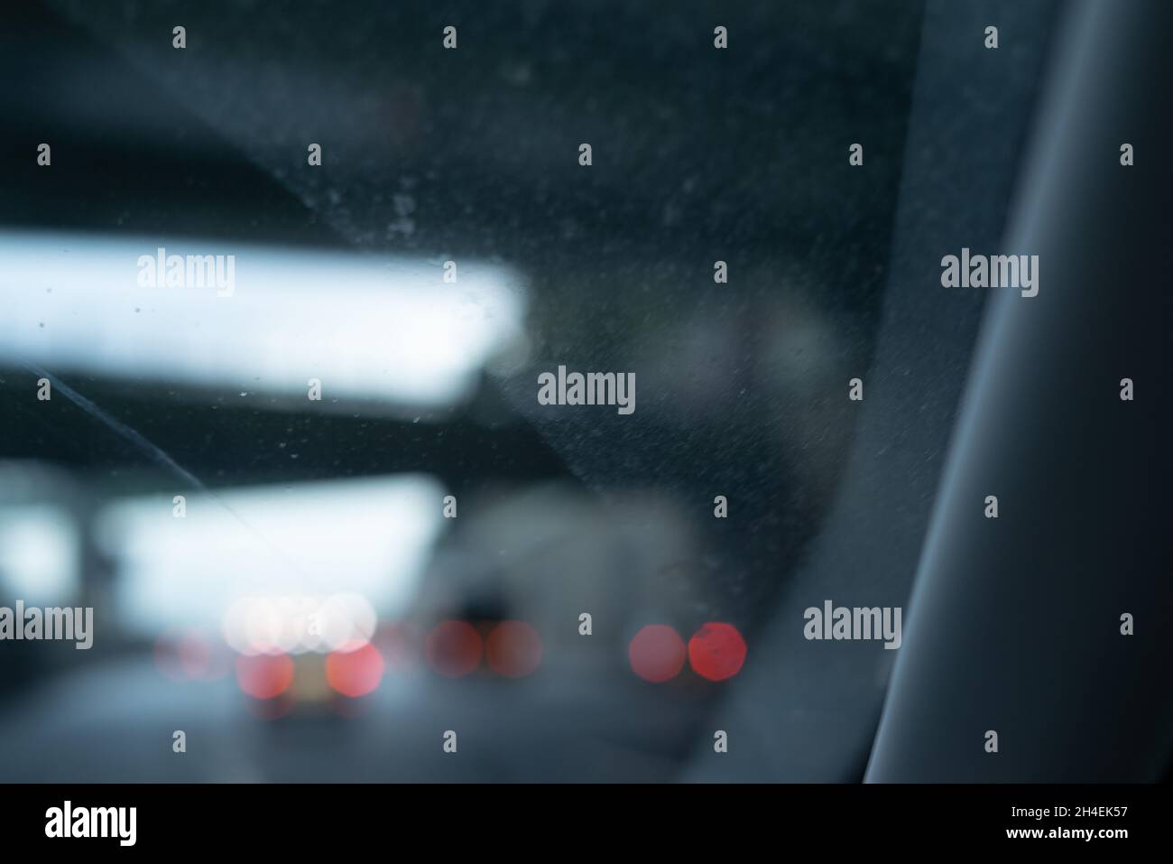 Cars and car lights in evening traffic from inside the car with cinematic light in the car Stock Photo