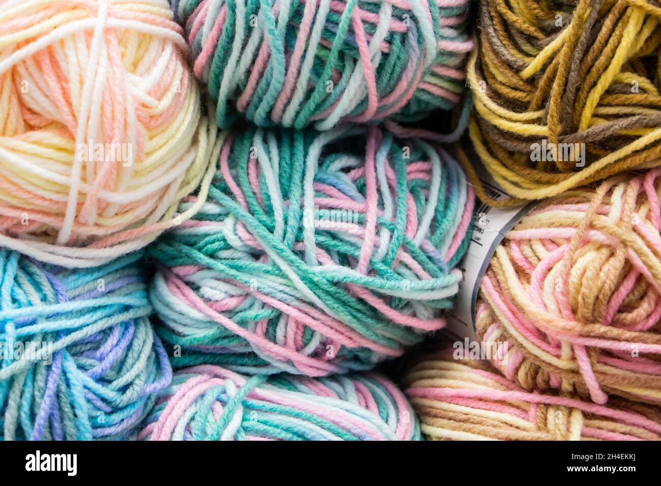 Many balls of wool yarn for knitting. Selling fluffy threads in a craft store Stock Photo Alamy