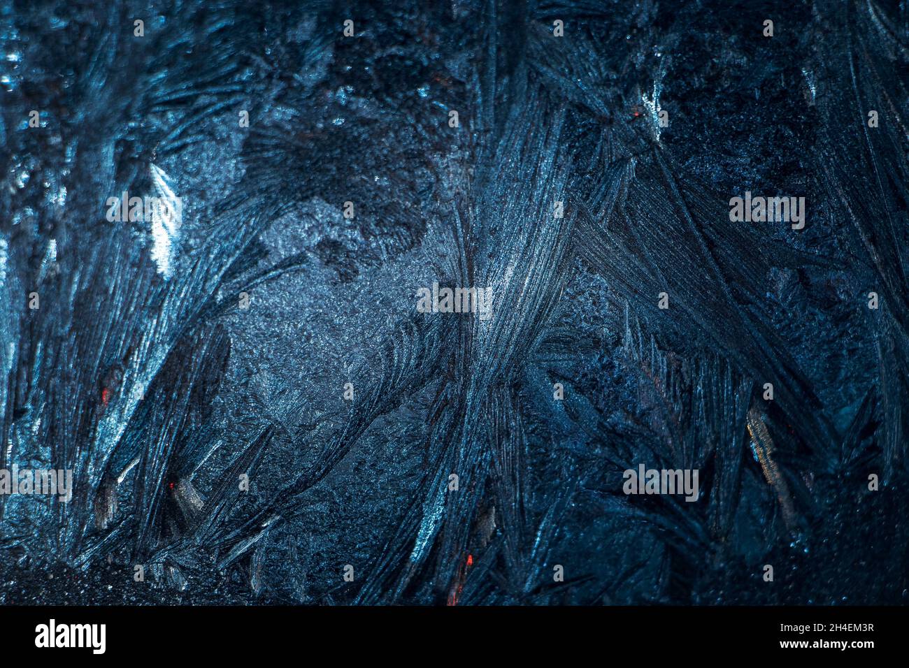 Frosty patterns on glass. Christmas background. Blue ice on winter ...