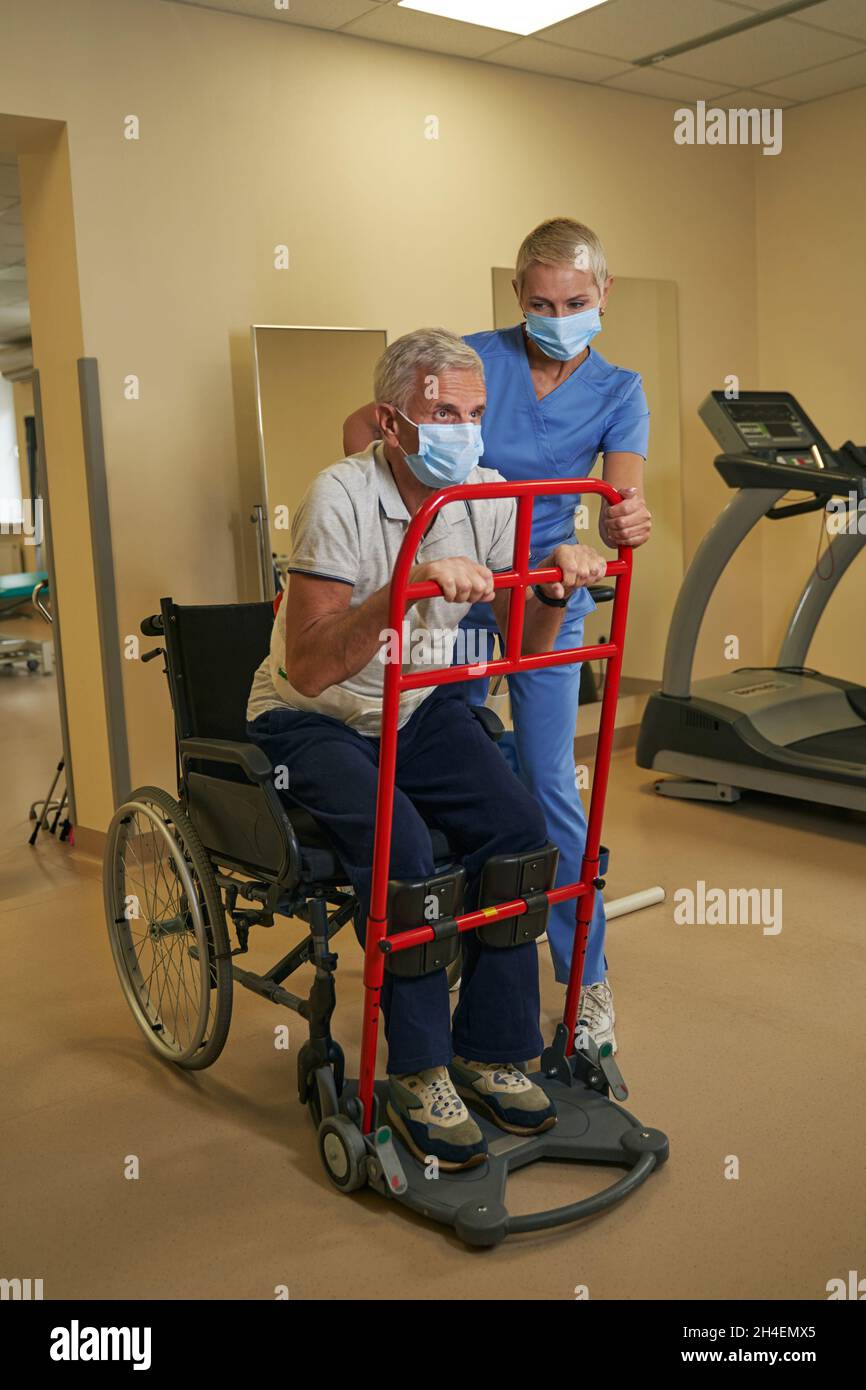Stroke patient restoring mobility skills in rehab center Stock Photo Alamy