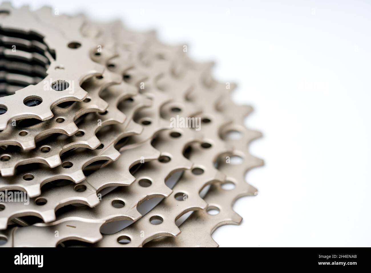 Gears, sprockets and chain of a mountain sports bike on a white