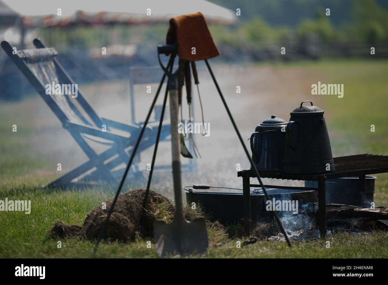 Campfire in the camp with a boiling kettle on it Stock Photo - Alamy